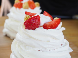 the chef decorates the dessert with fresh raspberries and strawberries. Anna Pavlovna's dessert