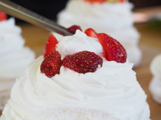 the chef decorates the dessert with fresh raspberries and strawberries. Anna Pavlovna's dessert