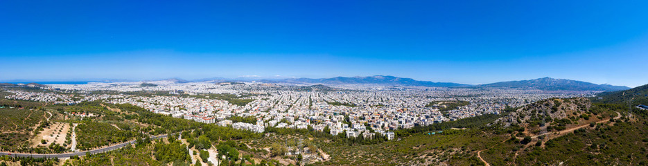 Fototapeta na wymiar Athens Greece panorama. Aerial view of Athens city from Hymettos mount, sunny summer day.