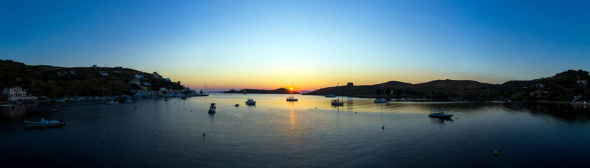 Kea Tzia island, Cyclades, Greece. Panorama of Vourkari marina at sunset.