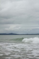 Small waves breaking off the West coast, New Zealand. 