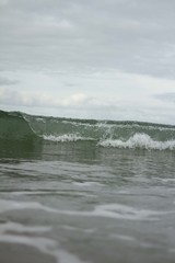 Small waves breaking off the West coast, New Zealand. 