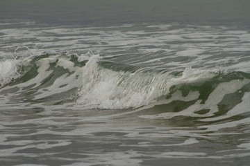 Small waves breaking off the West coast, New Zealand. 