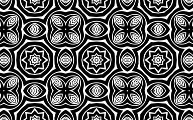 Black and white abstract ethnic geometric pattern background in exotic African, Mexican, Native American and oriental print style with geometric shapes.