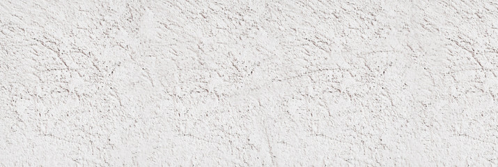 Concrete wall. Weathered old paints on the spilled wall.