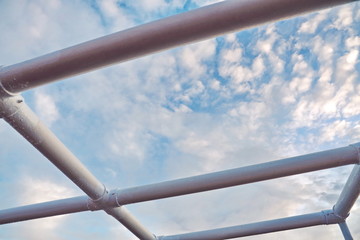 Ship structures, masts, antennas, funnel, ship wheelhouse against the blue sky and clouds. Vessel traveling at ocean. © masterskuz55