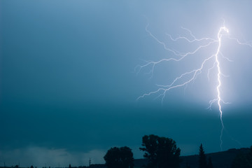 A powerful lightning strike, a demonstration of the power of nature.