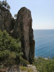 single high cliff, sea, sun, wilderness without people