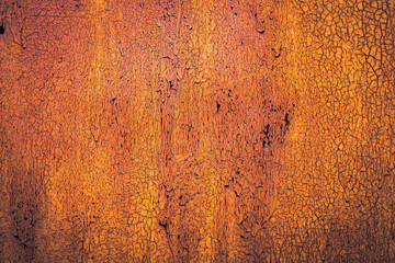 The old iron background is painted yellow, orange, purple, red in with rust and chips