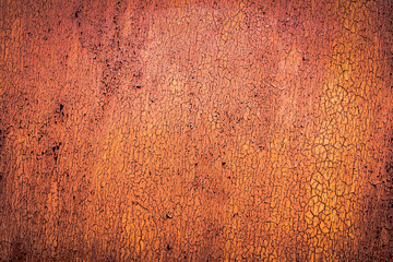 The old iron background is painted yellow, orange, purple, red in with rust and chips