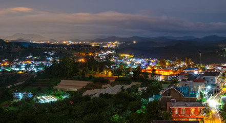 Small village in a tea hill valley on sunset sky in Da Lat, Vietnam. The place provides a great deal of tea for the whole country