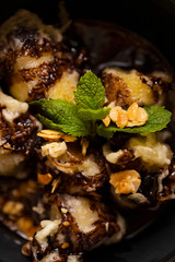 Banana dessert sweet ice cream close up on a dark background festive food on the table