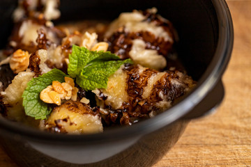 Banana dessert sweet ice cream close up on a dark background festive food on the table