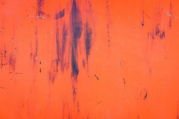 The old iron background is painted yellow, orange, purple, red in with rust and chips