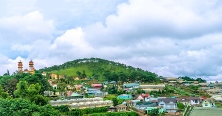 Small town on a stormy morning with moving clouds on the top of the hill and the valley is the peaceful in Da Lat, Vietnam