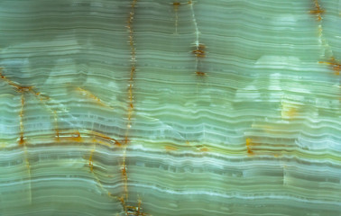 Mineral stone with abstract stripes has been formed of volcanic rock that has been molten and...