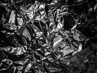Abstract texture pattern metallic paper using as a background or wallpaper. Metal aluminum foil...