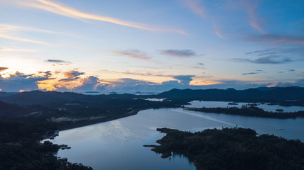 Aerial view of Kenyir Lake during blue hour sunrise.