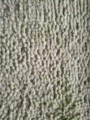 Stone texture on a wall using pebbles of small size.