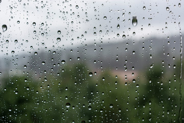 drops of water on the glass on a rainy day, glass with drops of water