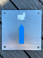 Way of Fatima sign composed by a blue arrow at Esposende, Portugal. Blue arrow on the ground...