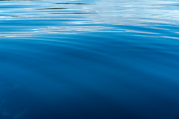 Top view with pattern wave. Blue color deep ocean water. Sea surface. Soft blue ocean wave. turquoise water.  Clear water texture background.