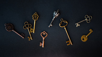 Many different old keys from different locks, scattered chaotically,