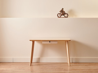 Modern and new style decorative wooden table and chair concept in the room, yellow background wall style with accessory book and lamp.