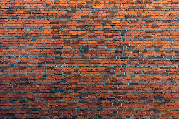 Red brick building wall. Interior of a modern loft. Background for design and interview recording.