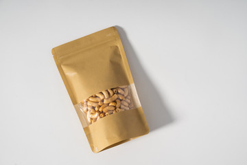 blank standing pouch mockup laying over white background © Odua Images