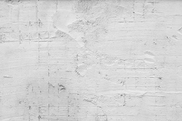 White wall of the building. Rough plaster surface. Abstract background.