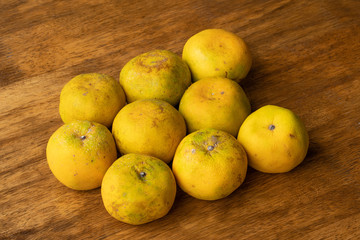 Tangerine or Bang Mot tangerine famous orange in Thailand on wooden table.