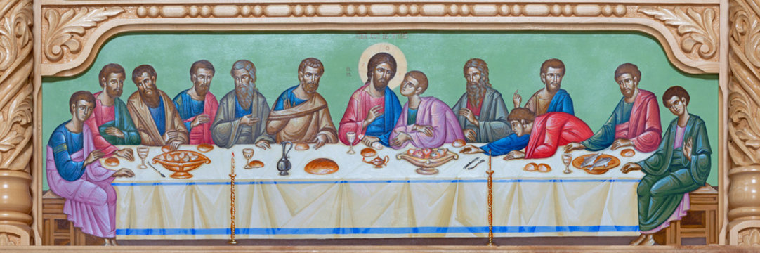 REGGIO EMILIA, ITALY - APRIL 12, 2018: The icon of Last Supper scene on the iconostas in church Chiesa di San Giorgio in Reggio Emilia from 20 cent.