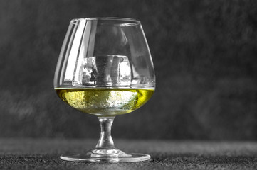 Glass of Chartreuse on the rocks