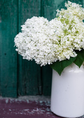 bouquet of white hydrangea on an old wooden background