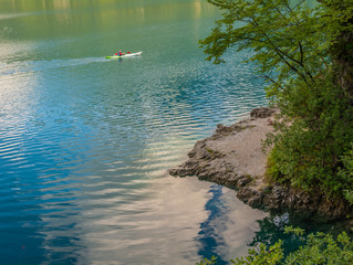 on canoeing on Ledro lake in Ledro Valley, Trentino Alto Adige - northern Italy