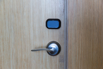 Smart card door key lock system in hotel. Hotel electronic lock on wooden door. Entrance door with electronic card lock security. Digital door lock security systems for access protection of hotel