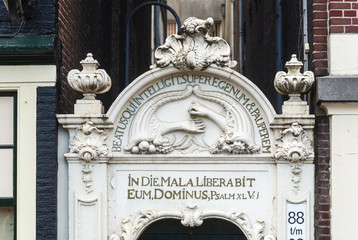 sculpture above a door of a patrician house in Amsterdam