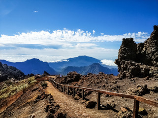Naklejka na ściany i meble Roque de Los Muchachos. La Palma, Canary islands, Spain. Landscape of mountains and rocks at peak point of the volcano. Popular tourist attraction
