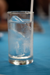 Water in a glass, selective focus