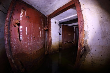 rooms of an abandoned flooded bomb shelter