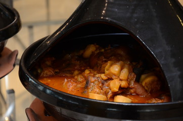 Moroccan tagine of lamb legs with onions. Traditional Moroccan Algerian Tunisian tagine