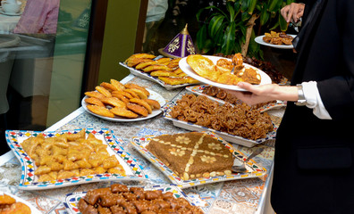 Moroccan buffet, traditional Moroccan food, tagine, chebakia, and Arabic sweets