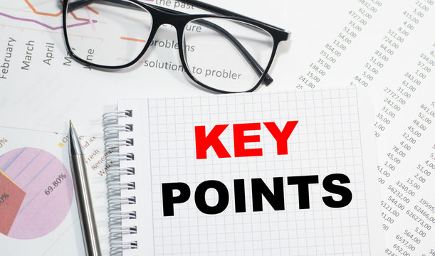 KEY POINTS on a table against the background of financial statements, next to a calculator and a pen.