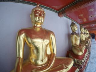  Row of sitting meditating Buddha sculptures in Wat Pho, Temple of Reclining Buddha