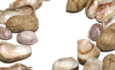Raw peanuts top view isolated on white background.