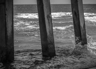 black and white water under the pier - Powered by Adobe
