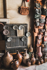 Many unique handmade clay jugs and vases on local arabian market. Souk in medina Marrakech.