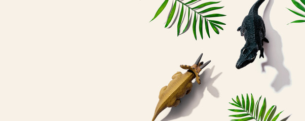 Tyrannosaurus and triceratops figures with shadow - flat lay © Tierney