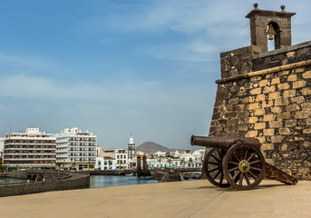 A view of the Islet of the English, the Castle of Saint Gabriel and the shoreline of Arrecife, Lanzarote on a sunny afternoon